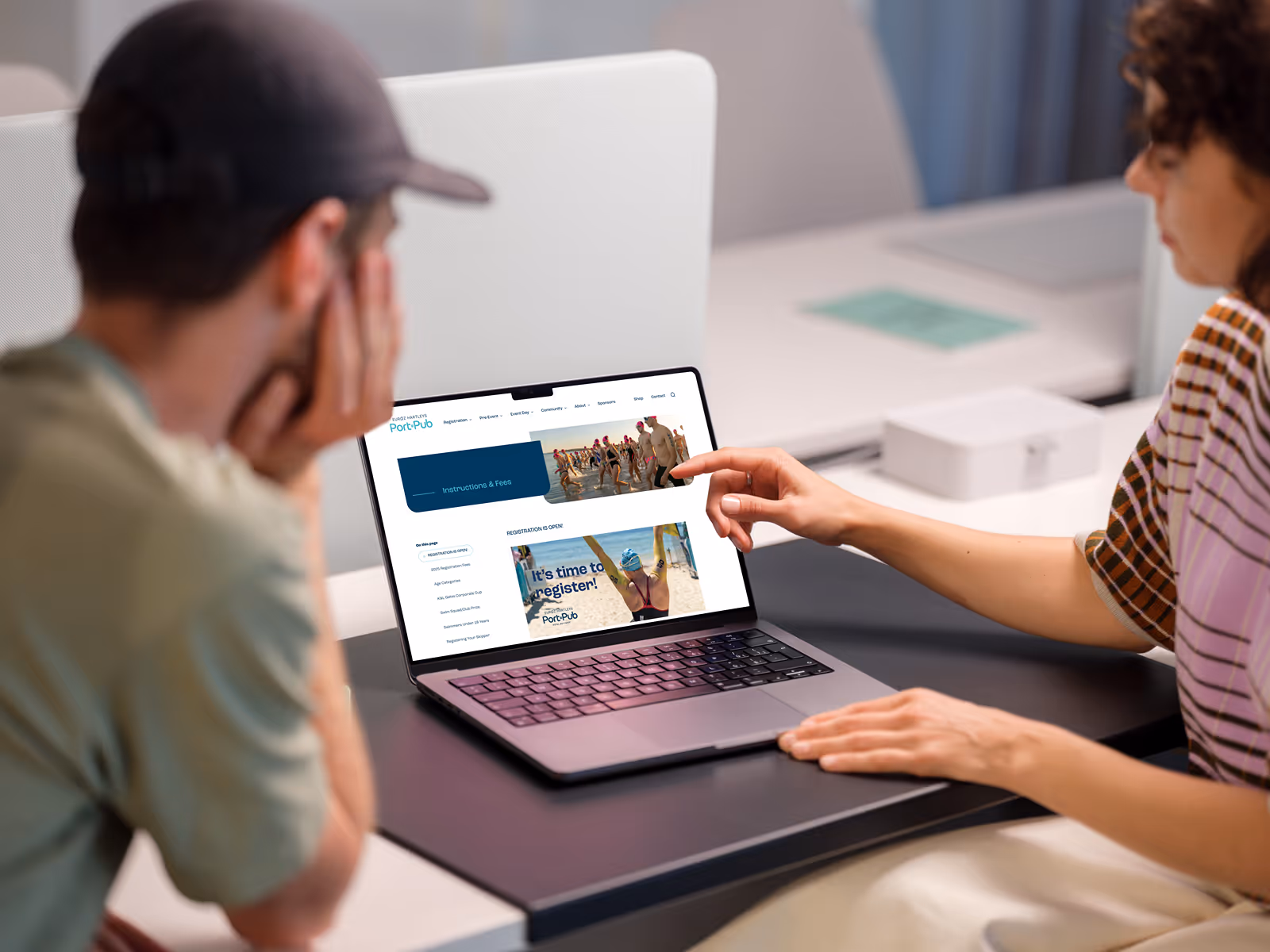Man and Woman checking Instructions and Fees on the Port to Pub Website