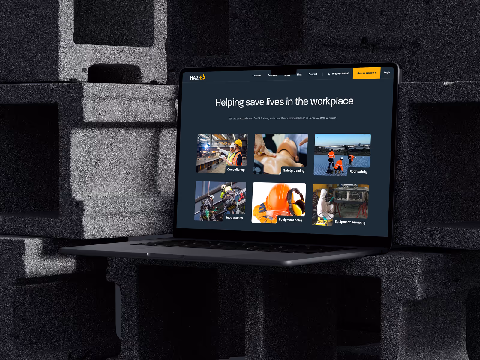 Haz-Ed website mockup on an Apple Macbook