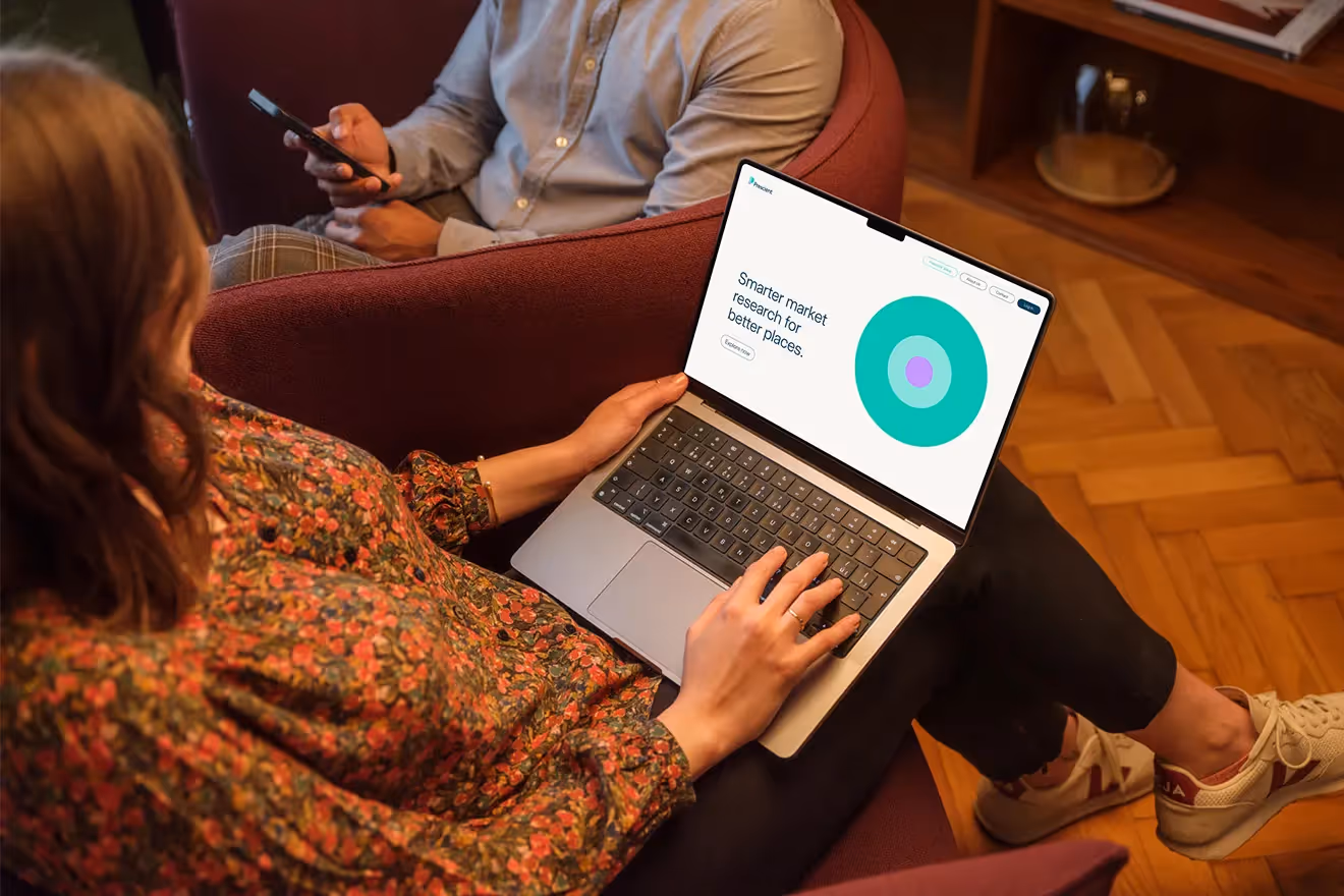 Woman using the Prescient website on a Macbook